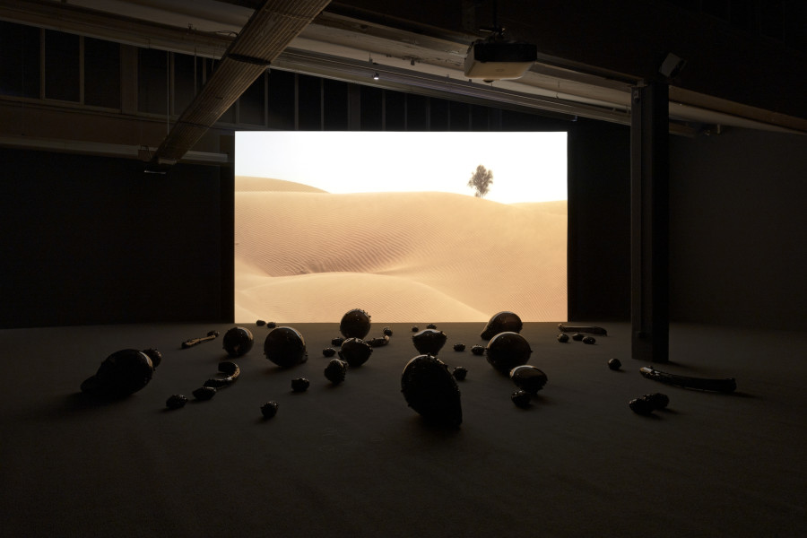 Monira Al Qadiri, Holy Quarter, 2020, 20 min. video and glass sculpture installation. © Monira Al Qadiri. Commissioned by Haus der Kunst, Munich (2020). Courtesy Sammlung Kerstin Hiller & Helmut Schmelzer. Installation view Kunsthaus Baselland 2023. Photo: Gina Folly
