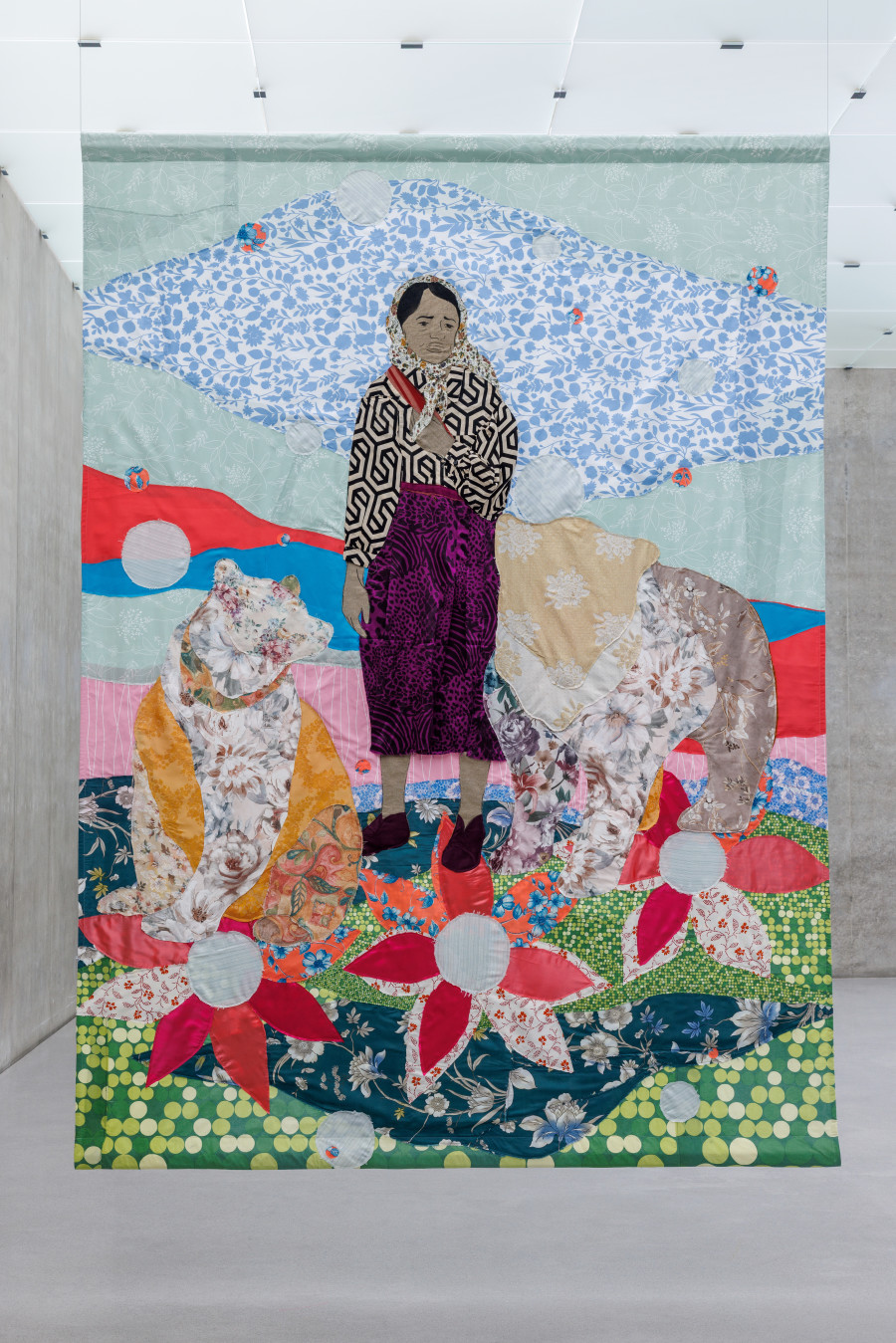 Małgorzata Mirga-Tas, Tełe Ćerhenia Jekh Jag, Exhibition view third floor Kunsthaus Bregenz, 2025, Romani Ćhaj peskreja Ryćhinoha (Romani girl with a bear), 2025. Photo: Markus Tretter. © Małgorzata Mirga-Tas, Kunsthaus Bregenz. Courtesy of the artist, Foksal Gallery Foundation, Warsaw, Frith Street Gallery, London, Karma International, Zurich