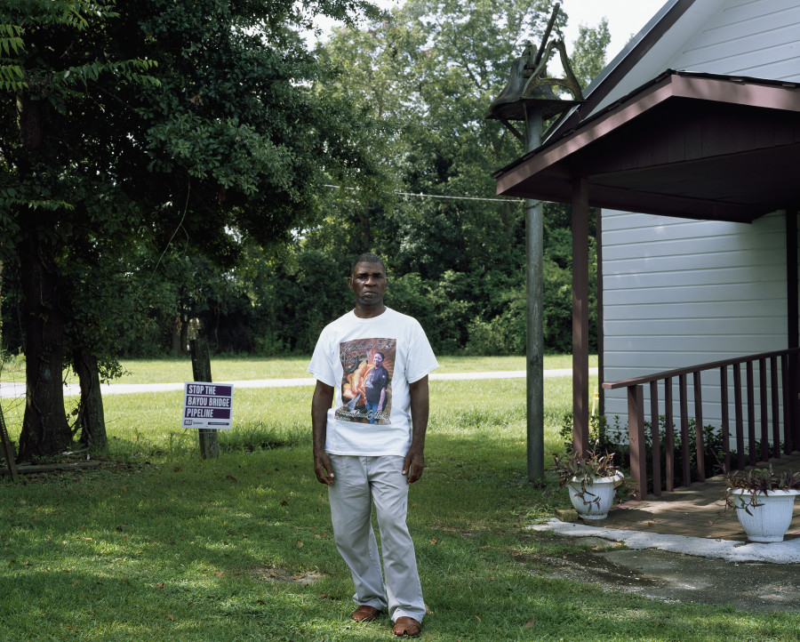 Pastor Harry Joseph of Mount Triumph Baptist Church in front of his church, Saint James, Louisiana, August 7, 2017. Inkjet print (Canson Baryta Photographique paper) mounted on Dibond, Plexiglas box, 126 x 157 x 5 cm, Ed. 1/3 + 2 AP