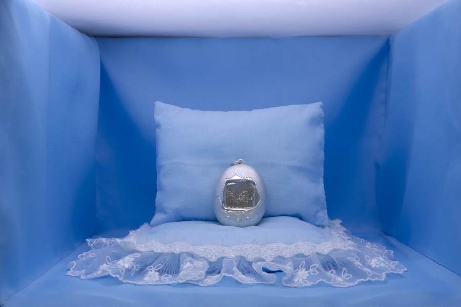 Jennifer Merlyn Scherler, Grave Friend (early generation, international version), 2025, hand-hammered silver, polyester textile, lace, stuffing, Japanese paper, 18 × 28 × 31 cm. Photography: Gina Folly / all images copyright and courtesy of the artists and For, Basel