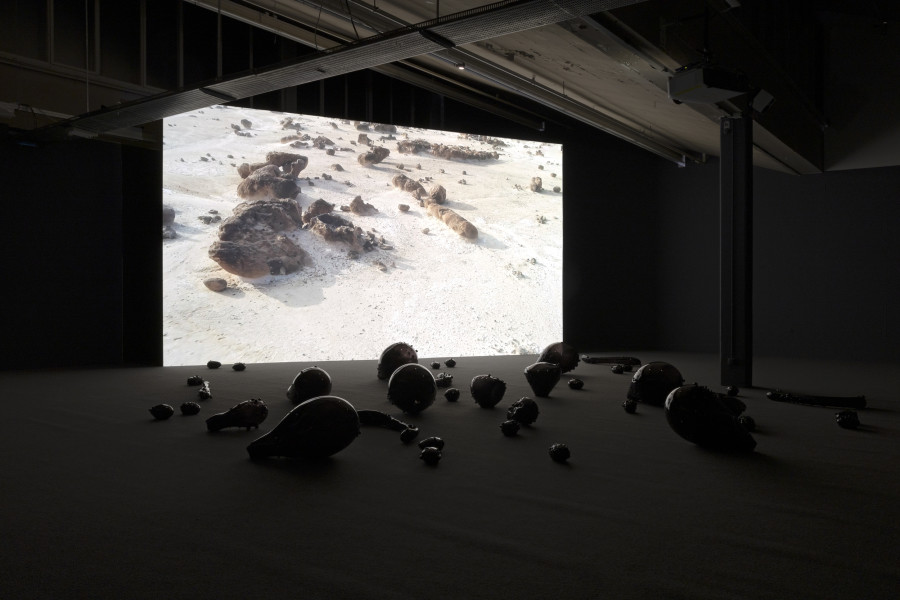 Monira Al Qadiri, Holy Quarter, 2020, 20 min. video and glass sculpture installation. © Monira Al Qadiri. Commissioned by Haus der Kunst, Munich (2020). Courtesy Sammlung Kerstin Hiller & Helmut Schmelzer. Installation view Kunsthaus Baselland 2023. Photo: Gina Folly