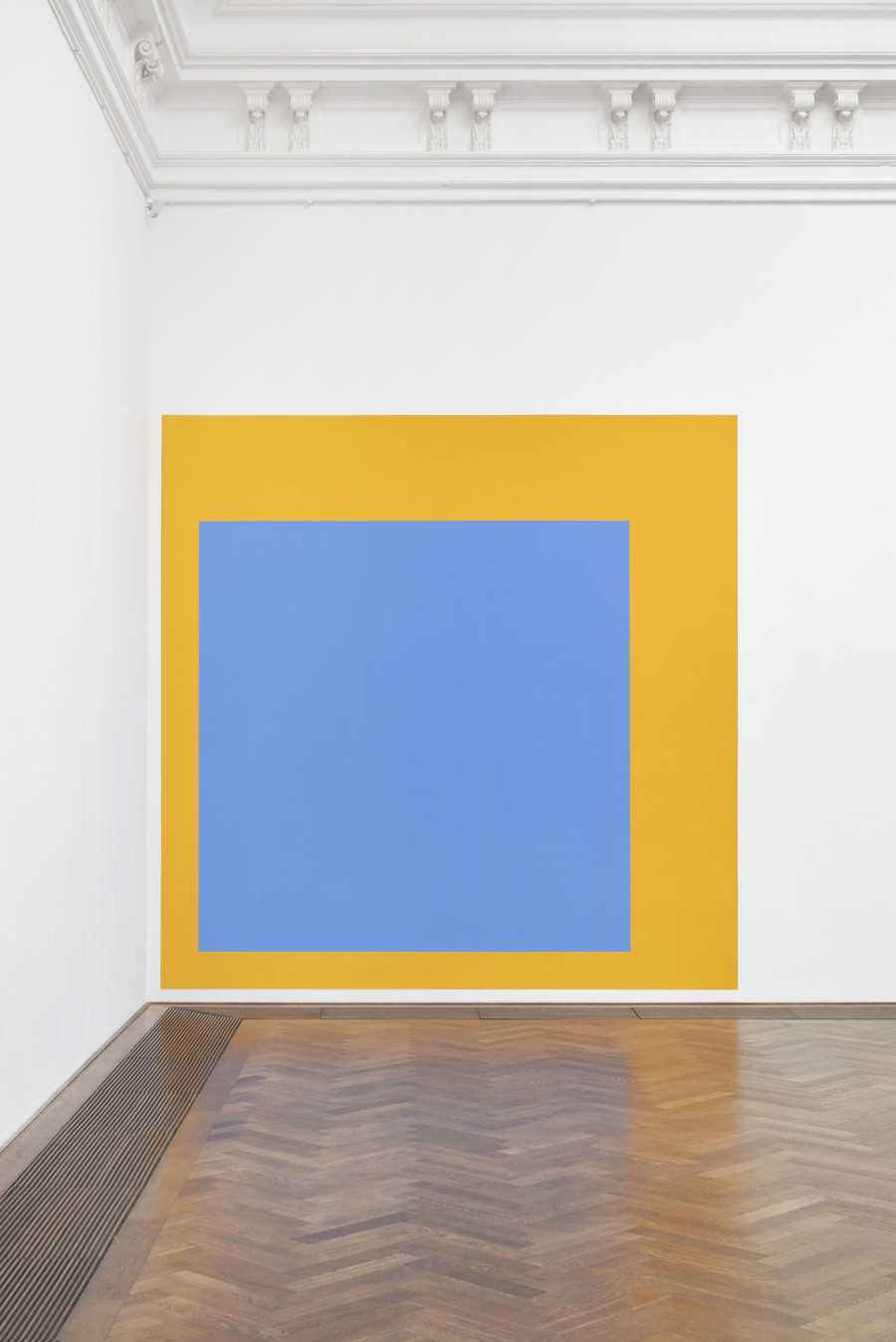 Ghislaine Leung, Care, 2024, detail, in: Ghislaine Leung, Commitments, Kunsthalle Basel, 2024, photo: Philipp Hänger / Kunsthalle Basel. Score: A wall is equivalent to all the days in a year. The 2016 child care hours the artist would need to cover working full time are shown as a banana rectangle. The 1140 free childcare hours supported by the UK government are shown inset as a cobalt square. All works courtesy the artist; Maxwell Graham, New York; and Cabinet, London.