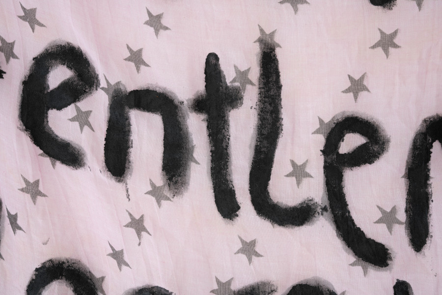 Billy Morgan, Detail of Red Letters (Panowie), 2025, acrylic on fabric, 200 × 90 cm. On view at the solo show Lackadaisies, curated by marytwo, jevouspropose, Zurich, 2025. Courtesy the artist and marytwo. Photo: marytwo, Elvira Baettig