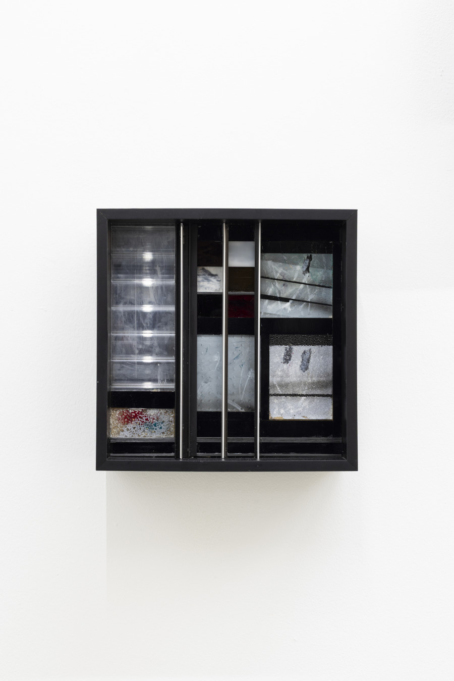Sebastian Haas, “A Border of Silence”; from the Solo Show “Reminisce-Supports” at KALI Gallery, Lucerne, CH; Oil, spraypaint on reverse glass, plexiglass, foil, aluminium, textile, wood; 40 x 40 x 10 cm, 2026. Courtesy of the Artist and KALI Gallery. Photo by Kim da Motta