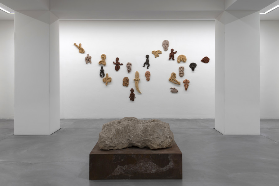 Exhibition view, Fragments, On searching, finding and showing the (in)complete, Bündner Kunstmuseum Chur, 2025. Vorne: Markus Casanova, Zwei liegende Torsi, 1990, Hinten: Martin Disler, Wandskulpturen, 1993. Photo credit: Thomas Strub