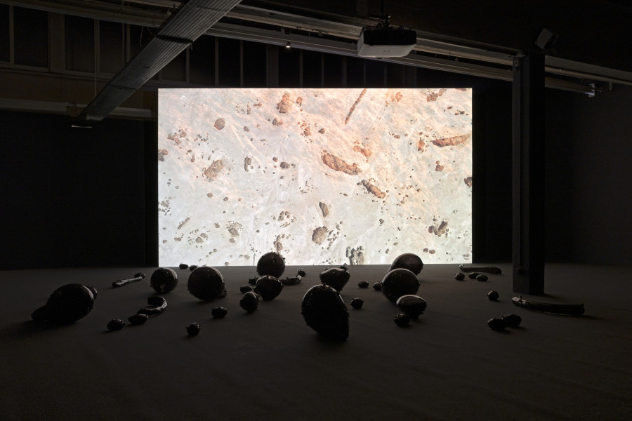 Monira Al Qadiri, Holy Quarter, 2020, 20 min. video and glass sculpture installation. © Monira Al Qadiri. Commissioned by Haus der Kunst, Munich (2020). Courtesy Sammlung Kerstin Hiller & Helmut Schmelzer. Installation view Kunsthaus Baselland 2023. Photo: Gina Folly