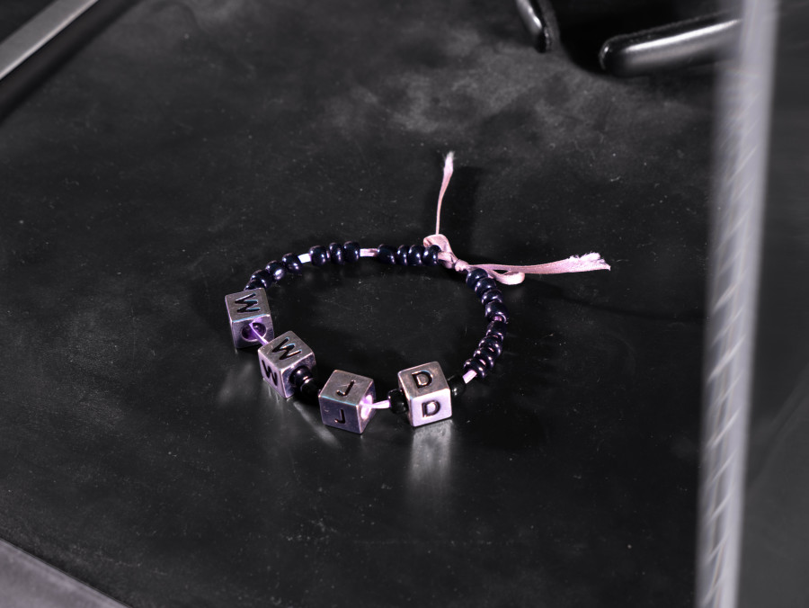 Julian-Jakob Kneer, FANATIC (8) (Detail), 2025, Archival Satanic Bible, WWJD bracelet, Disneyland Tokyo headband, archival Peter Sotos PURE #1 zine, cast rubber and acrylic glas vitrine, 76 x 54 x 35 cm. Courtesy the artist and Blue Velvet, Zurich. Exhibition views by Andrea Luca Ammann.