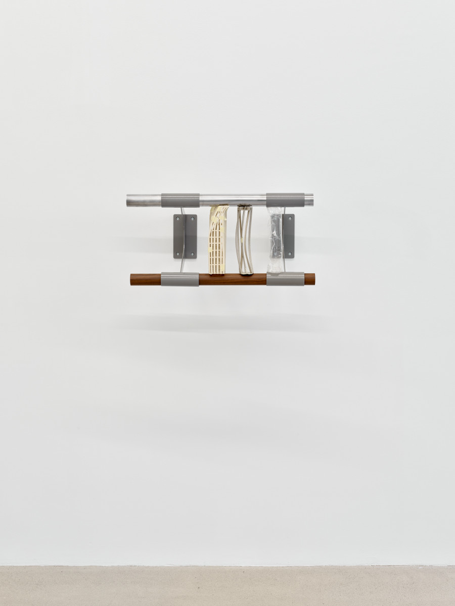 Christiane Blattmann, Dependers, 2025, Barre holders, aluminum, cardboard, archival polypropylene, 29 × 59 × 31 cm. Damien & The Love Guru, 2025. Courtesy of the artist and Damien & The Love Guru, Brussels/Zurich. Photography : Felix Jungo