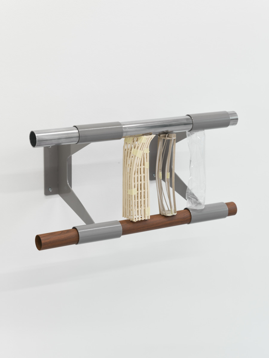 Christiane Blattmann, Dependers, 2025, Barre holders, aluminum, cardboard, archival polypropylene, 29 × 59 × 31 cm. Damien & The Love Guru, 2025. Courtesy of the artist and Damien & The Love Guru, Brussels/Zurich. Photography : Felix Jungo