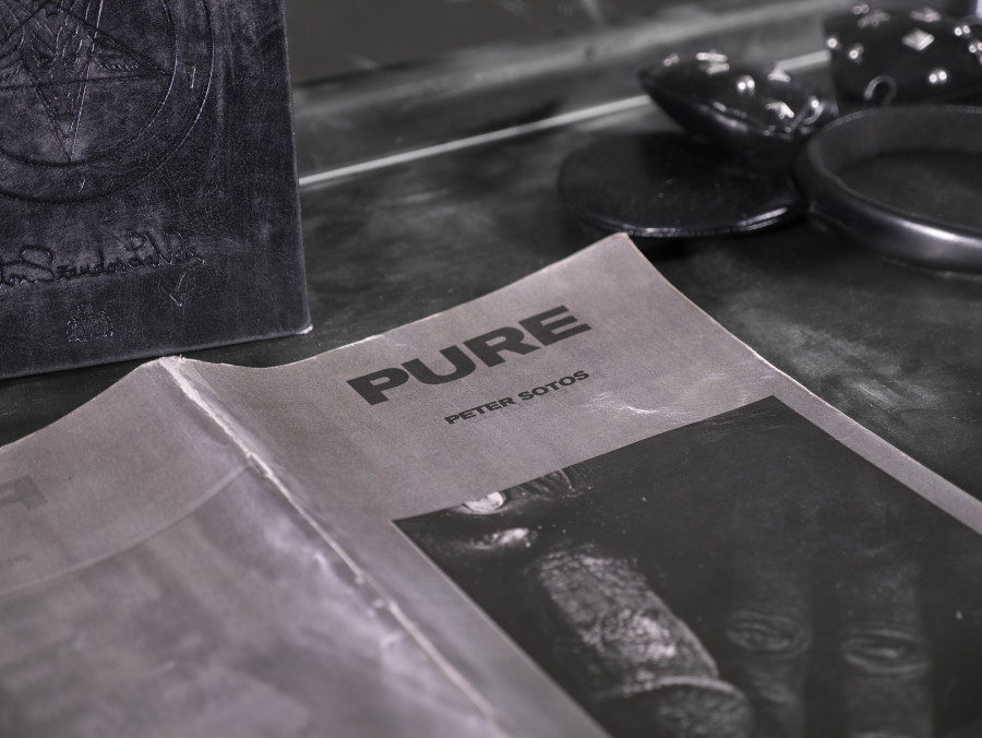 Julian-Jakob Kneer, FANATIC (8) (Detail), 2025, Archival Satanic Bible, WWJD bracelet, Disneyland Tokyo headband, archival Peter Sotos PURE #1 zine, cast rubber and acrylic glas vitrine, 76 x 54 x 35 cm. Courtesy the artist and Blue Velvet, Zurich. Exhibition views by Andrea Luca Ammann.