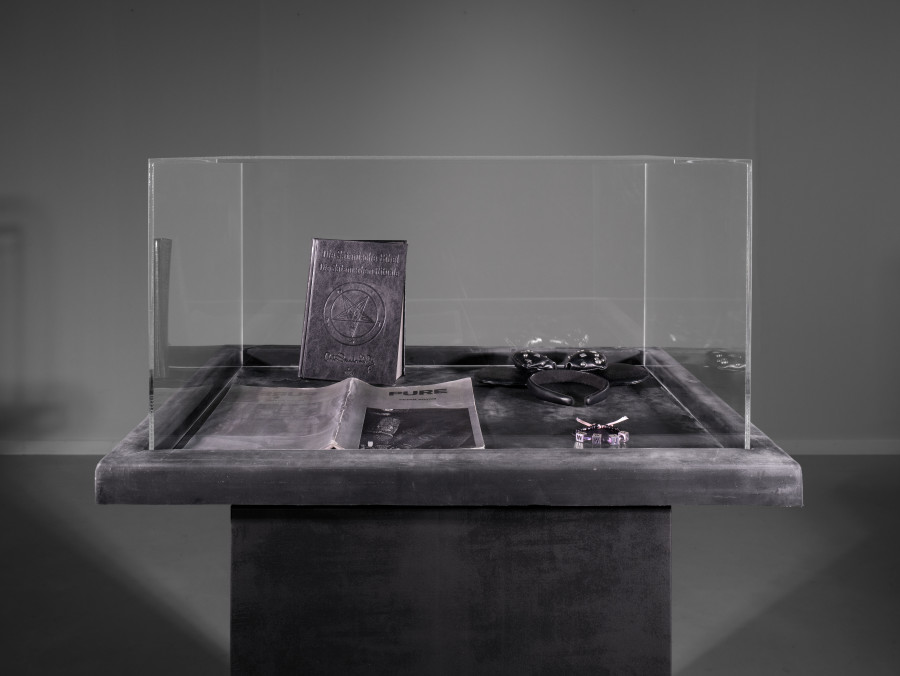 Julian-Jakob Kneer, FANATIC (8), 2025, Archival Satanic Bible, WWJD bracelet, Disneyland Tokyo headband, archival Peter Sotos PURE #1 zine, cast rubber and acrylic glas vitrine, 76 x 54 x 35 cm. Courtesy the artist and Blue Velvet, Zurich. Exhibition views by Andrea Luca Ammann.
