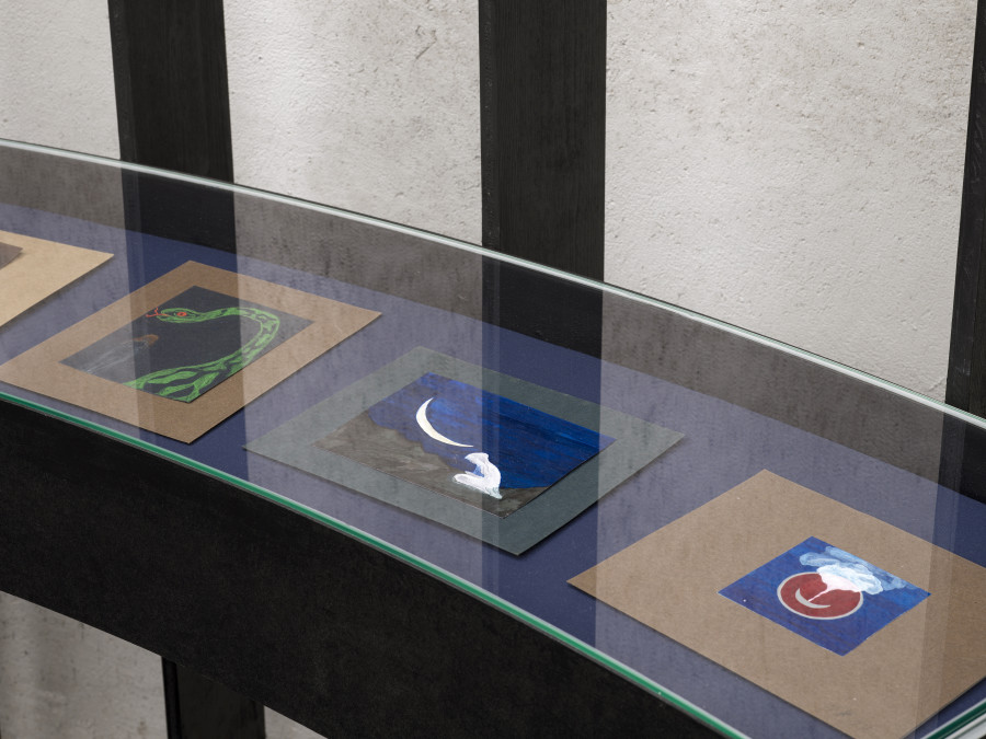 Exhibition view Emma Jung & Rebecca Ackroyd «Tage und Nächte», Cabaret Voltaire 2025; Emma Jung-Rauschenbach, Drawing of the magic dragon (Urgo Series), undated; Drawing of a white figure with crescent moon (Urgo Series), undated; Drawing of a smoking crescent moon (Urgo Series), 1917. Photo: Cedric Mussano. Courtesy: Familienarchiv Jung, © 2007 Stiftung der Werke von C.G. Jung, Zürich.