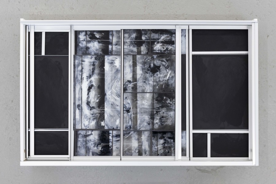 Sebastian Haas, “Grey Noise”; from the Solo Show “Reminisce-Supports” at KALI Gallery, Lucerne, CH; Oil, spraypaint on reverse glass, plexiglass, carbon, aluminium, wood; 100 x 58 x 20 cm, 2026. Courtesy of the Artist and KALI Gallery. Photo by Kim da Motta