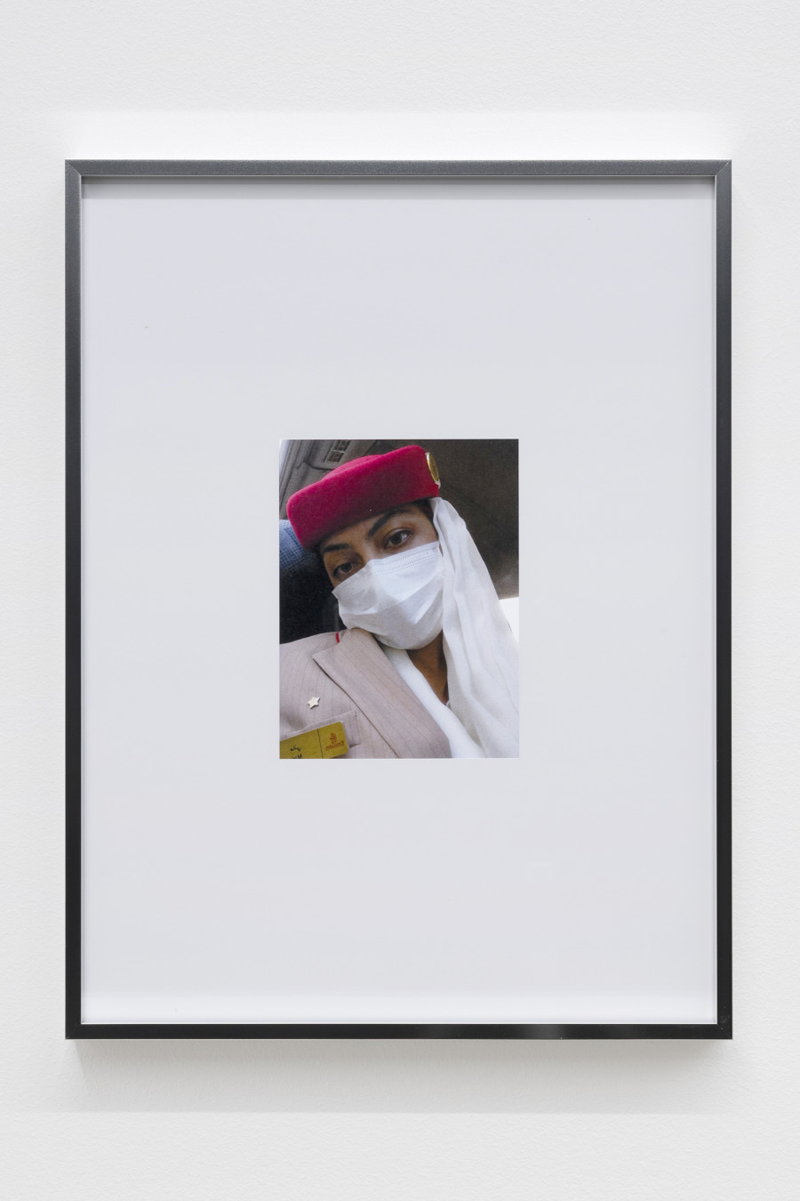 Mati Jhurry, duty free_Emirates Staff No.460596, 2025, Series of 9 photographs pulled from the archive of performance Emirates Staff no. 460596, digital print on paper, aluminium frame, 31 × 41 × 2 cm each. Photography: Gina Folly / all images copyright and courtesy of the artists and For, Basel